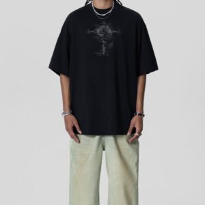 Man wearing a black oversized t-shirt with a dark rose graphic