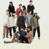 Custom 310 GSM Light-Wash Cotton Long-Sleeve T-Shirt 2151 - Style E491BC Group of diverse models wearing light-wash, oversized long-sleeve t-shirts in various colors.