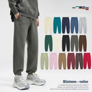 Man wearing grey jogger sweatpants with multiple color options displayed
