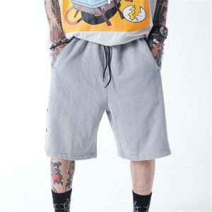 Grey acid wash drawcord jersey shorts on a person