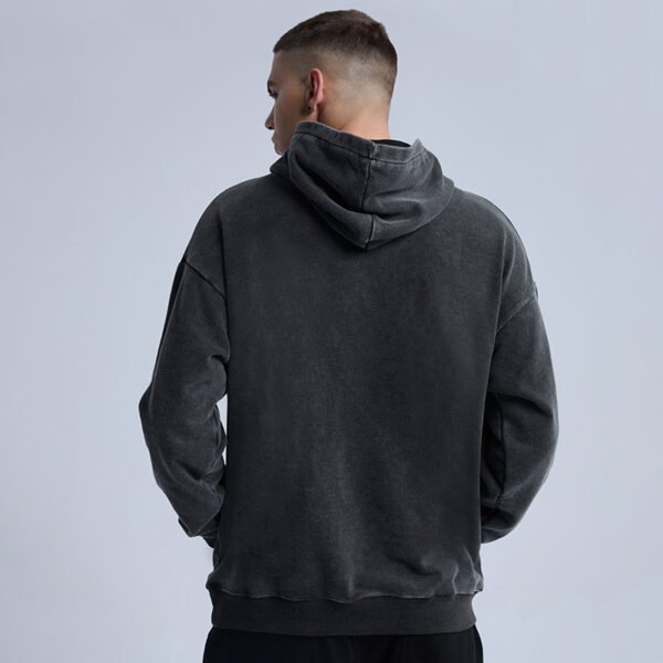 Custom Acid-Wash Pullover Hoodie With Balanced Sleeves - Style 183D5C Rear view of a man wearing a dark gray acid-wash oversized pullover hoodie