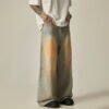 Custom acid-wash wide-leg denim jeans with controlled drape