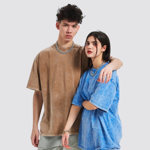 Couple wearing acid washed oversized t-shirts
