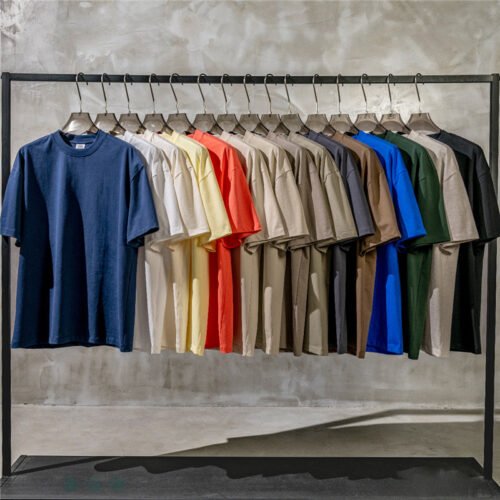 Custom All-Over Print Loose-Fit Shorts - Style 9248D6 Rack of multi-colored short sleeve t-shirts
