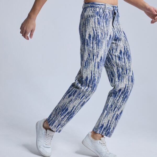 Man wearing blue all-over print straight-leg cotton jeans