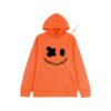 Orange hoodie with black face applique and drawstring