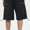 Black baggy cargo shorts with zip pockets and drawstring hem