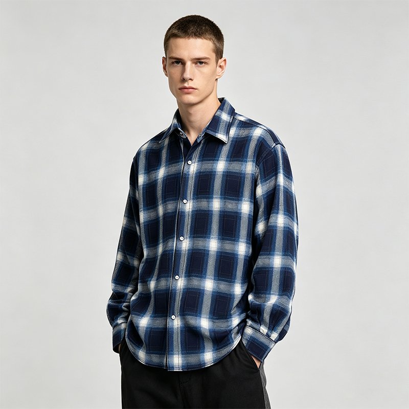 Man wearing a blue and white plaid long sleeve button-up shirt
