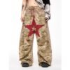 Camouflage wide-leg pants with frayed patchwork details and a red star applique.