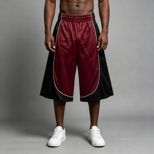 Custom Color-Block Piped Basketball Capri Pants | - Style A7BD25 Man wearing maroon and black basketball capri pants with white piping