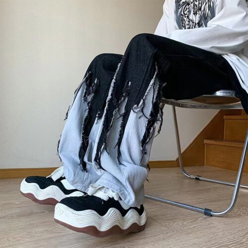 Custom Color-Block Fringe Straight-Leg Jeans - Style AE54D1 Close-up of light wash jeans with dark wash color-block and fringe detail