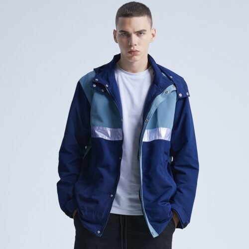 Custom Color-Block Hooded Zip Jacket | - Style 251019 Man wearing a navy and light blue color block hooded zip jacket with reflective stripes.