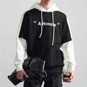 Man wearing a black and white layered hoodie with "A Hoodie" graphic