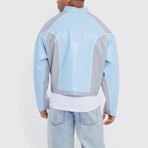 Blue and grey color-block jacket with white piping detail.