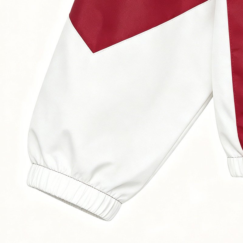 Red and white color-blocked zip jacket with elastic cuffs