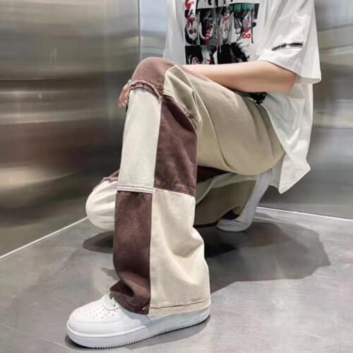 Color-blocked relaxed fit jeans with distressed details