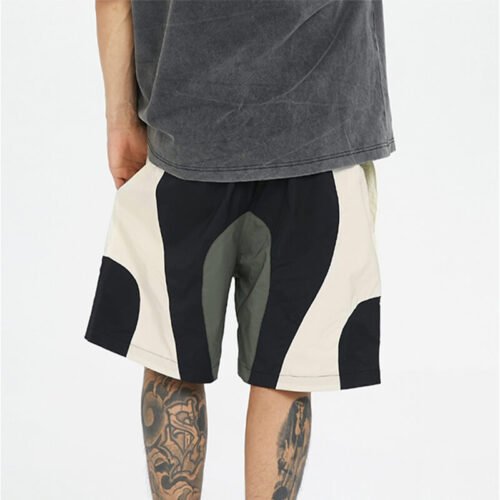 Man wearing custom colorblocked polyamide panel shorts