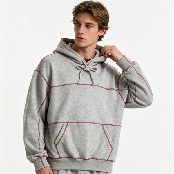 Custom Contrast-Stitch Oversized Pullover Hoodie - Style 9E41B1 Man wearing a grey oversized pullover hoodie with contrast stitching