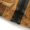 Custom Contrast-Trim Baseball Jacket 704-05 - Style 49897A Close-up of a tan and black baseball jacket zipper.