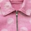 Custom Washed Cropped Canvas Zip Jacket - Style E91E23 Close-up of a pink washed canvas cropped zip jacket with a polka dot pattern.