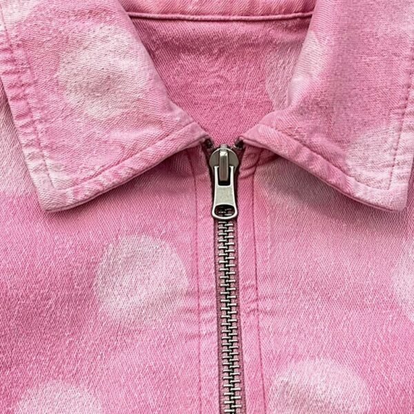 Custom Washed Cropped Canvas Zip Jacket - Style E91E23 Close-up of a pink washed canvas cropped zip jacket with a polka dot pattern.