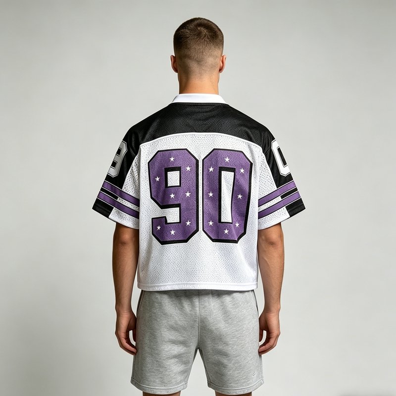 Cropped mesh football jersey with purple stars and the number 90