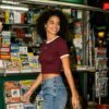 Custom Cropped Ribbed Knit Embroidered T-Shirt - Style E013B9 Woman in maroon ribbed crop t-shirt at newsstand