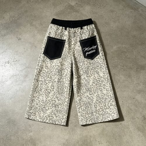 Leopard print cropped wide-leg pants with black back pockets and embroidered text