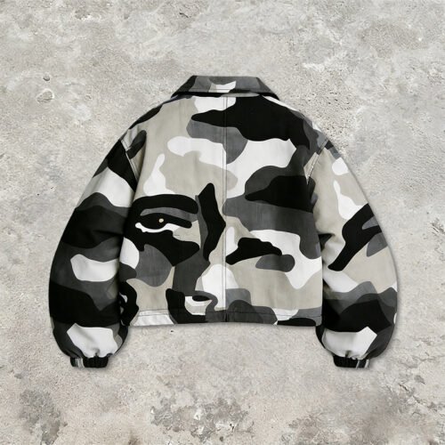 Back view of a grey and black digital camouflage cropped utility jacket