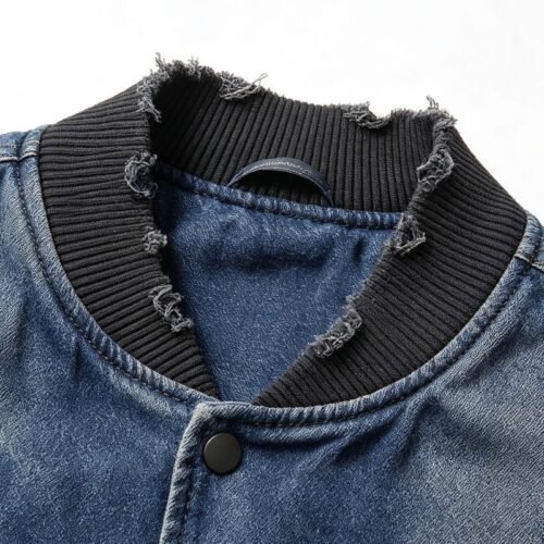 Blue denim baseball jacket with a distressed collar and ribbed trim