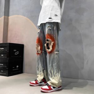 Custom distressed acid-wash flame graffiti jeans with ripped details