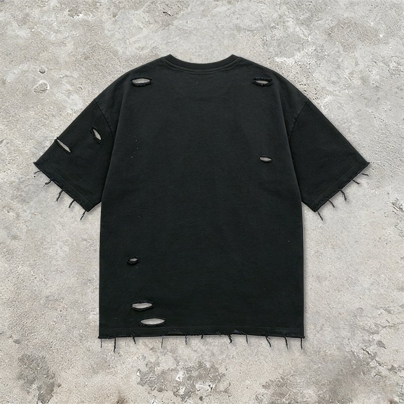 Black oversized distressed t-shirt with frayed edges and holes.