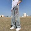 Custom Distressed Graphic-Wash Straight-Leg Jeans - Style C7B591 - product detail view 4