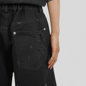 Close-up of custom washed distressed cargo shorts
