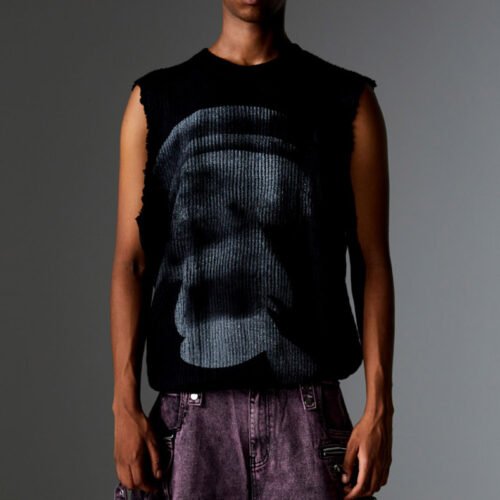 Black sleeveless knit sweater with distressed edges and face graphic