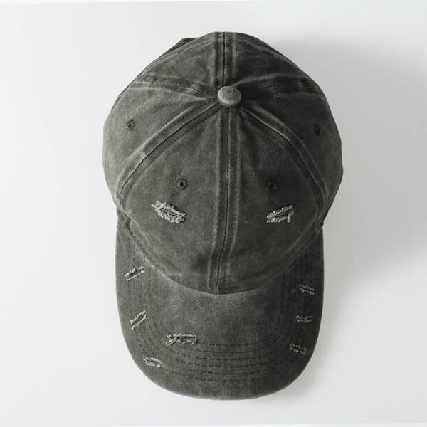 Dark green distressed vintage wash baseball cap with holes.