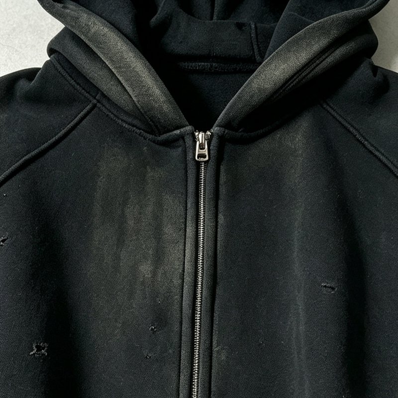 Black distressed washed zip hoodie with a silver zipper.