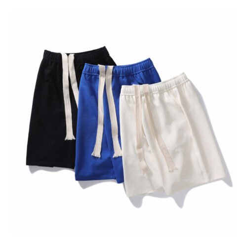 Three pairs of lounge shorts in black, blue, and white with drawstring waists.