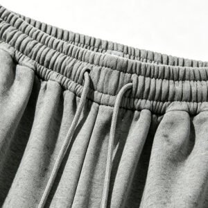 Close-up of grey elastic waist pants with drawstring