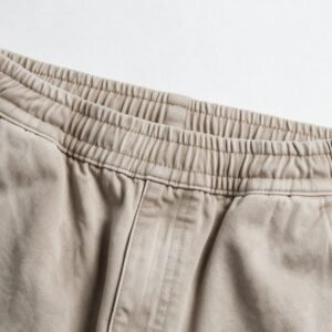 Close-up of beige vintage pants with elastic waistband