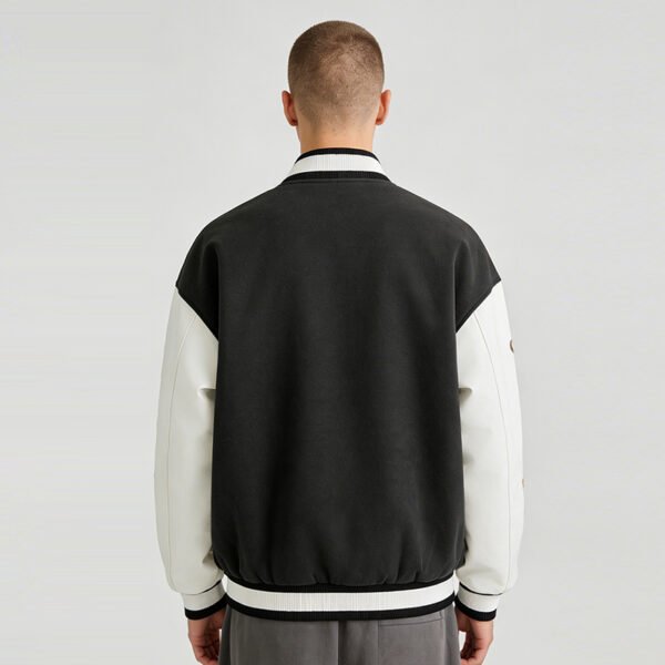 Custom Embroidered Two-Tone Varsity Jacket - VW-VJ01 - Style 879907 Back view of a two-tone varsity jacket with black body and white sleeves.