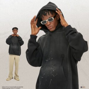 Oversized black zip hoodie with spray finish details.