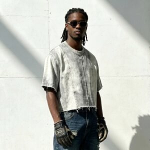 Man wearing a grey washed cropped t-shirt with frayed seams.