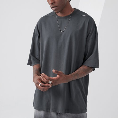 Custom Oversized Front-Zip Streetwear Shorts - Style A82126 Man wearing a dark grey oversized t-shirt with distressed hem