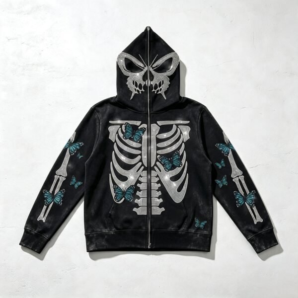 Black distressed full-zip hooded jacket with skeleton and butterfly rhinestone graphics.