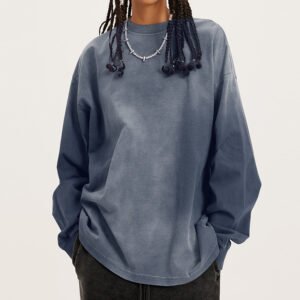 Person wearing an oversized, faded blue long-sleeve half-zip sweatshirt.