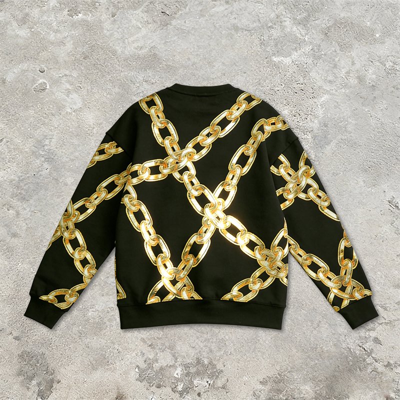 Black long-sleeve top with a gold chain graphic print