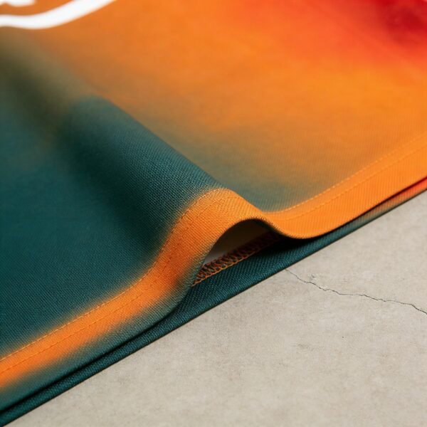 Close-up of a custom gradient polo shirt with orange and green colors.