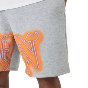 Man wearing grey fleece shorts with orange graphic print