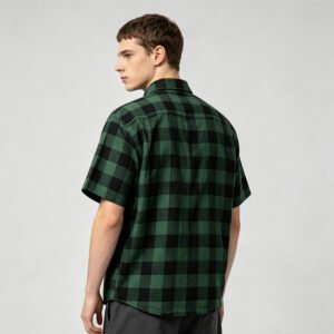 Man wearing a green and black plaid short-sleeve shirt from the back